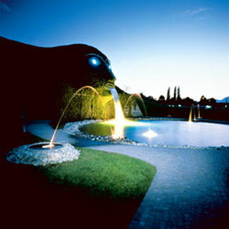 swarovski crystal world entrance at night in wattens, austria